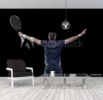 Bild på Tennis player with hands up isolated on black